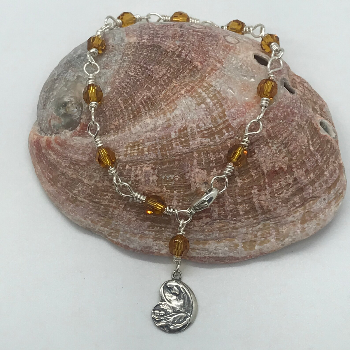 Topaz color crystal one-decade rosary bracelet with Madonna charm on stone