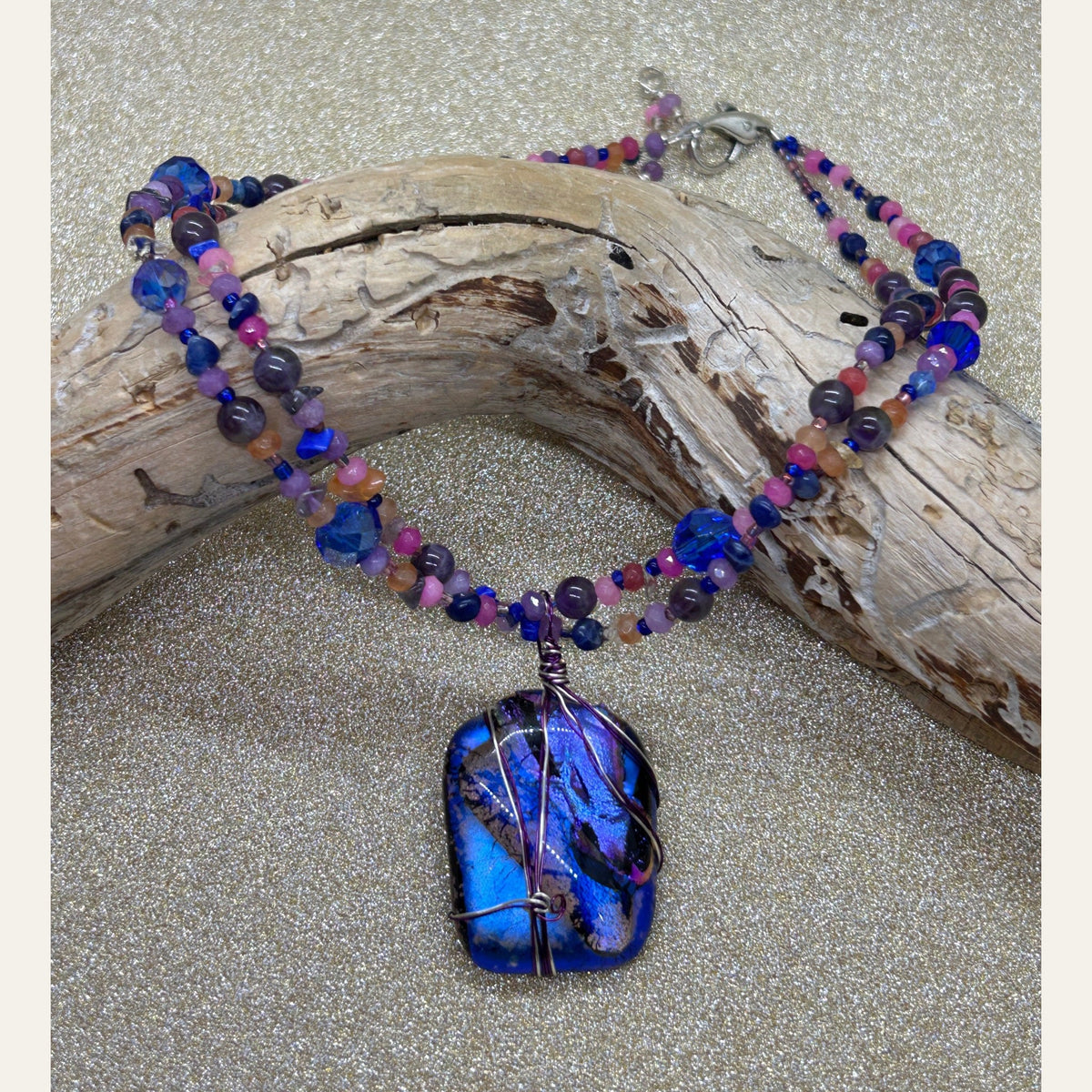 Electric blue and violet handmade dichroic glass necklace, photograph 2