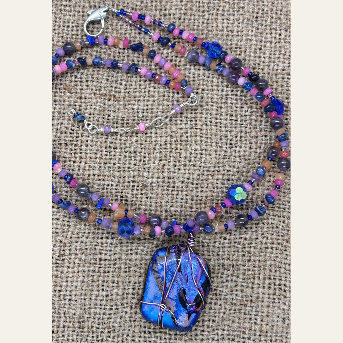 Electric blue and violet handmade dichroic glass necklace, photograph 4