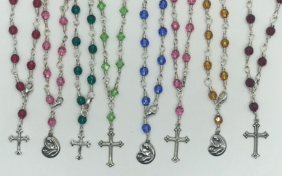 Available rosary bracelet colors and Cross or Madonna charm examples